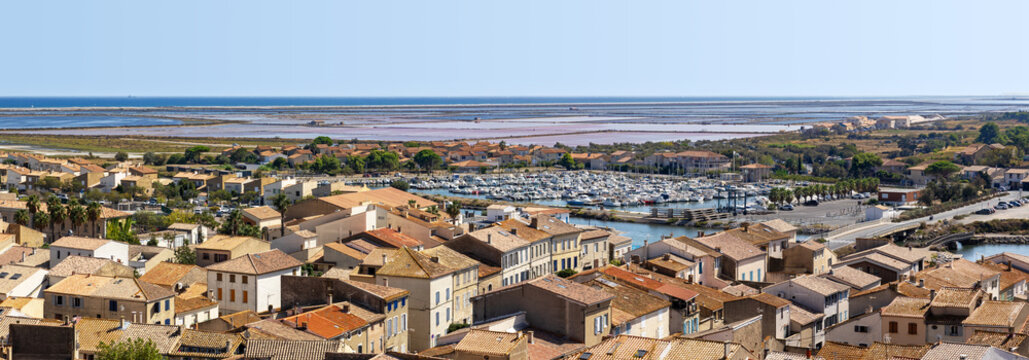 Panoramic view of Gruissan (Aude, France) seen from the Tour Barberousse on a sunny day in summer, with the Nautical Club Harbor, the  &Icirc;le Saint-Martin salines and the Mediterranean Sea