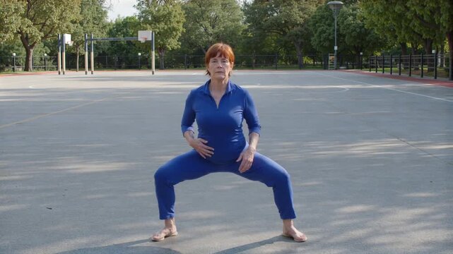 Woman shifting weight in tai chi stance