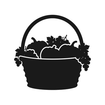 Black silhouette vector illustration of a basket filled with autumn harvest pumpkins and grapes