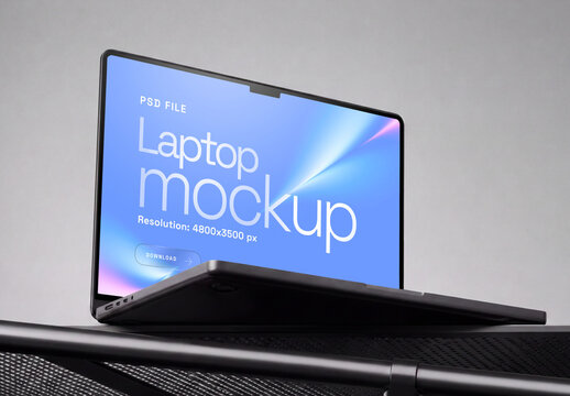 Laptop Mockup On Surface Angled Side Down View On Gray Background