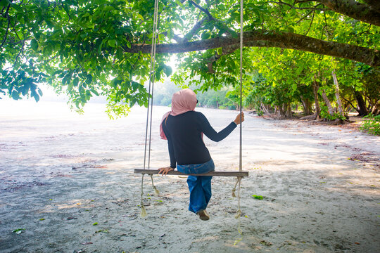 young man on swing