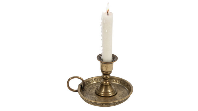 Vintage classic brass candlestick holder with a burning white wax candle isolated on transparent background.