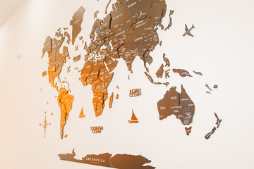Wooden World Map Mounted on Living Room Wall – Modern Interior Home Decor and Travel Concept © RetoricMedia