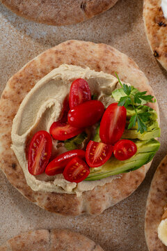 Healthy Vegetarian Pita with hummus, tomato and avocado