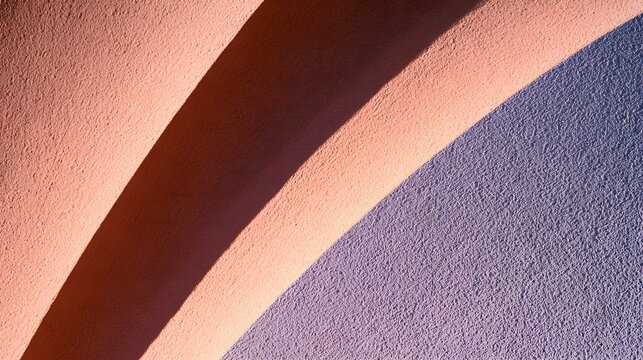 Aerial perspective on a textured plaster surface cut by three shadows