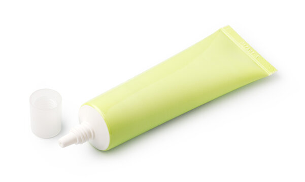 Lime green cosmetic tube with open nozzle and detached cap on white background