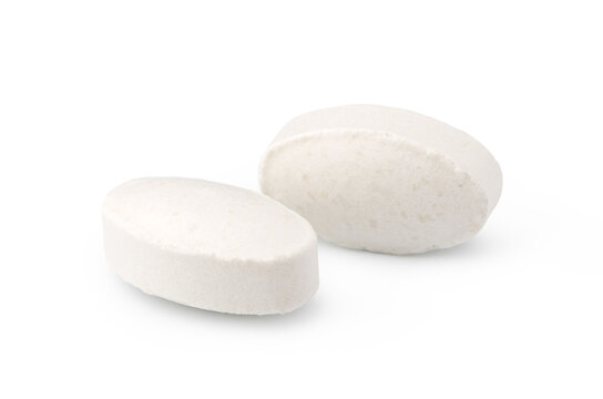 Two white oblong tablets isolated on a clean white background