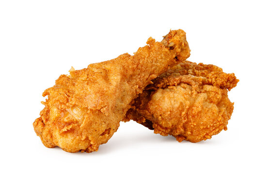 Crispy golden fried chicken drumsticks on white background