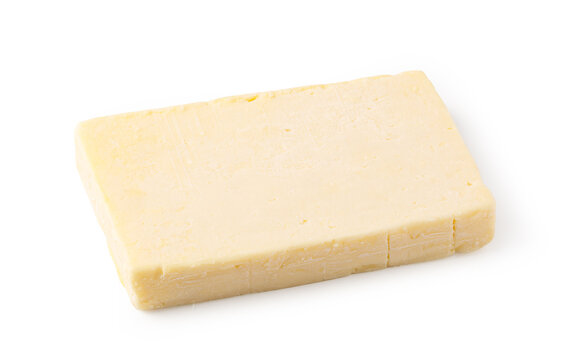 Pale yellow cheddar cheese block isolated on a white background
