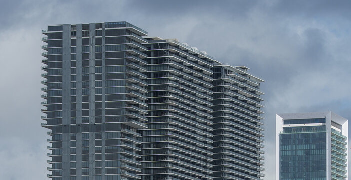 Modern Residential High-Rises with Balconies Beneath a Cloudy Sky