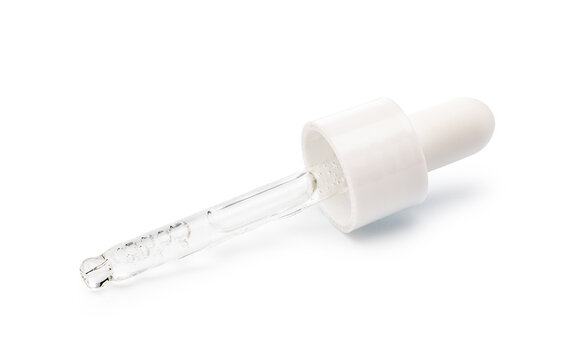 Glass pipette dropper with clear skincare serum on white background