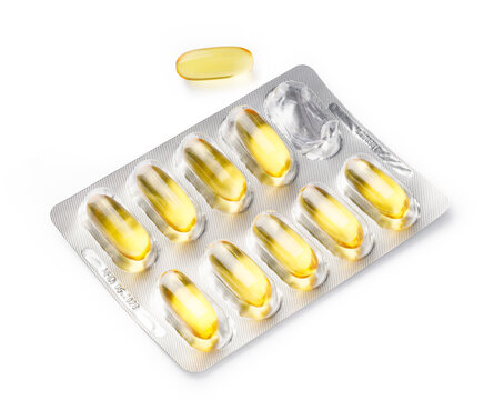 Yellow fish oil softgel capsules in a blister pack