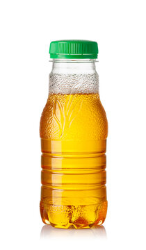 Iced tea in a clear plastic bottle with green cap on white