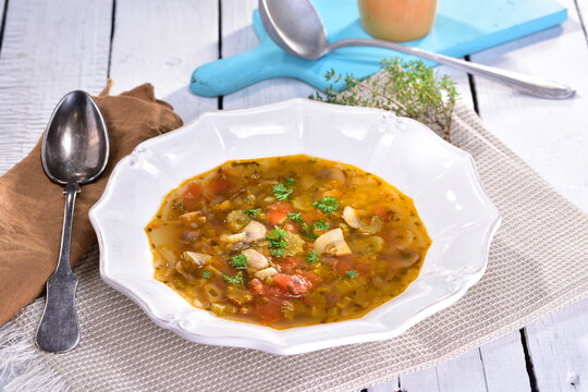 Soup with celery, mushrooms, and tomatoes