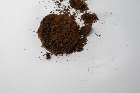 Used Coffee Grounds on White Background
