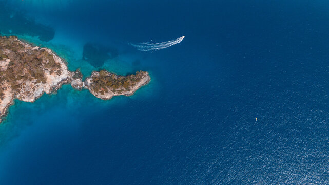 Aerial View of Speedboat Near Rocky Mediterranean Coast
