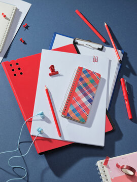 Organized desk supplies with red and blue accents