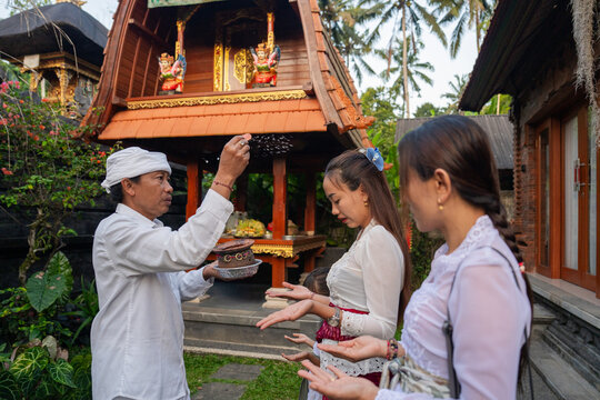 Ceremony in a Balinese Temple With Participants and Offerings