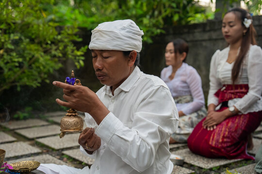 Traditional Ritual Practice in Bali With Offerings and Prayer