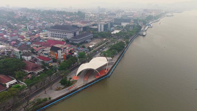 Aerial view of Teras Samarinda and Mahakam River under hazy skies in Samarinda, East Kalimantan, Indonesia.