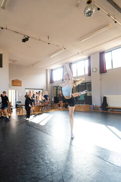 Solo dancer mid-turn in studio