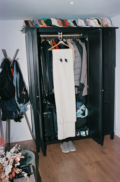 a homemade ghost costume hangs inside an open wardrobe, 35mm film