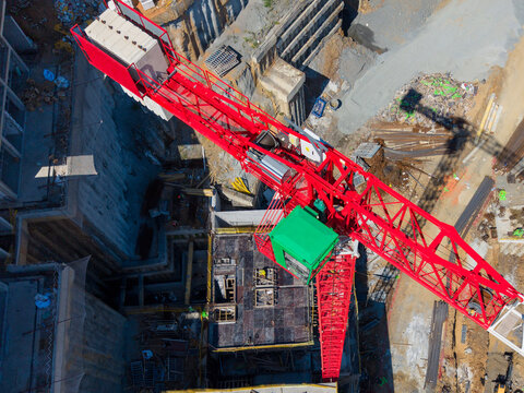 Aerial View Of Red Tower Crane And Construction Site