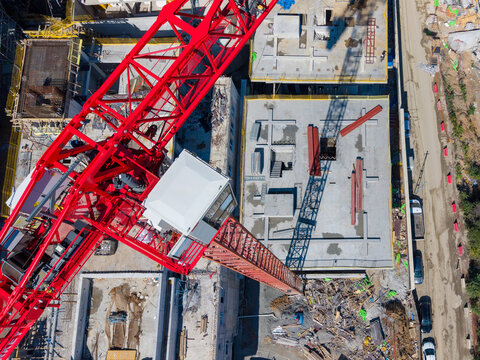 Aerial View Of Red Tower Crane And Construction Site