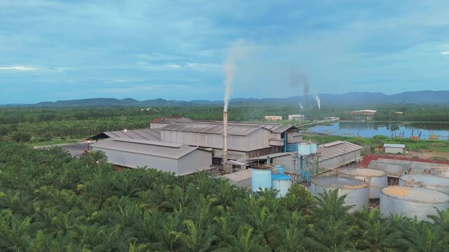Exhaust stack pipe releasing emissions dust reduces into environment. Aerial view shot monitoring and measurement of air pollution reduction to environmental, sustainability. Global warming, El Ni&ntilde;o.