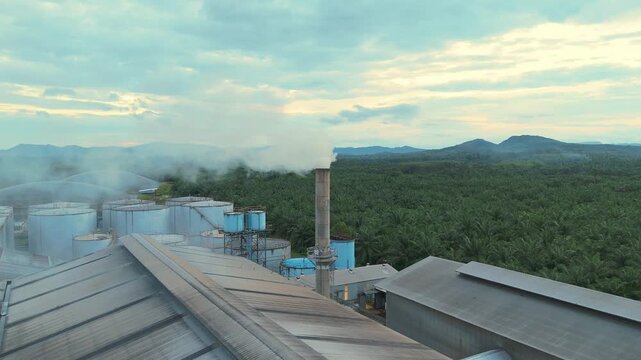 Exhaust stack pipe releasing emissions dust reduces into environment. Aerial view shot monitoring and measurement of air pollution reduction to environmental, sustainability. Global warming, El Ni&ntilde;o.