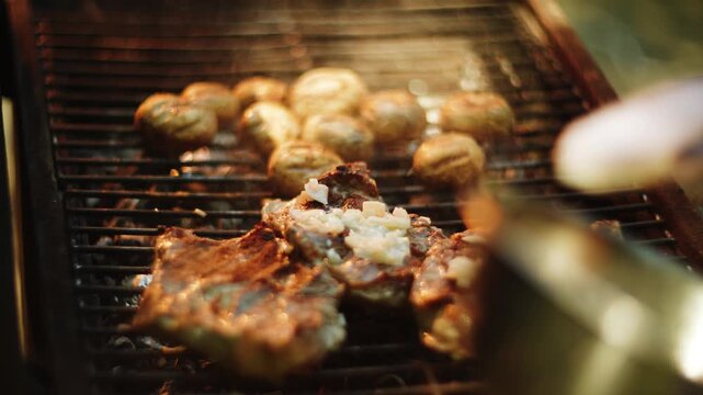 Grilling delicious meat and mushrooms on hot coals during an outdoor daytime cookout event