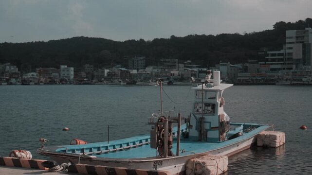 Small Fishing Boat Moored at Quiet Harbor in Gijang, Busan, South Korea