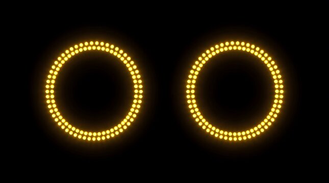 Two elegantly designed golden oval frames are brightly illuminated against a deep black background offering a luxurious and radiant aesthetic impression