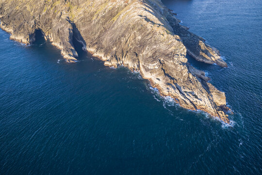 Aerial view of the rock formations and sea caves at Sheep's Head peninsula in County Cork Ireland.