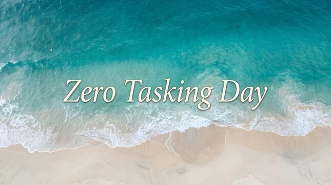 Zero Tasking Day text on beach waves and sand