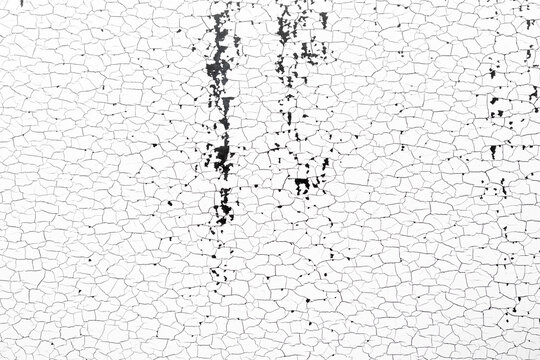 White cracked surface with irregular fissures forming a distressed grunge background