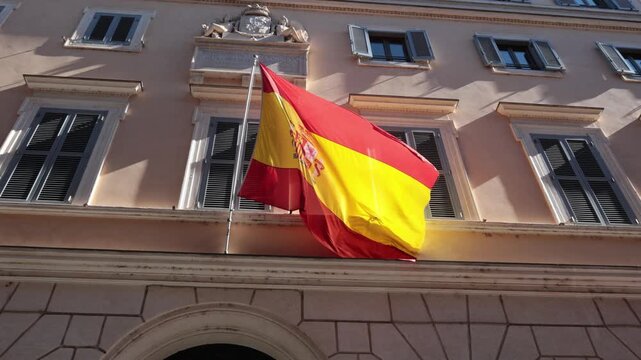 Spanish flag waving on embassy building facade