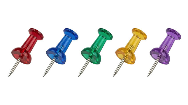 Colorful assortment of push pins aligned on black background