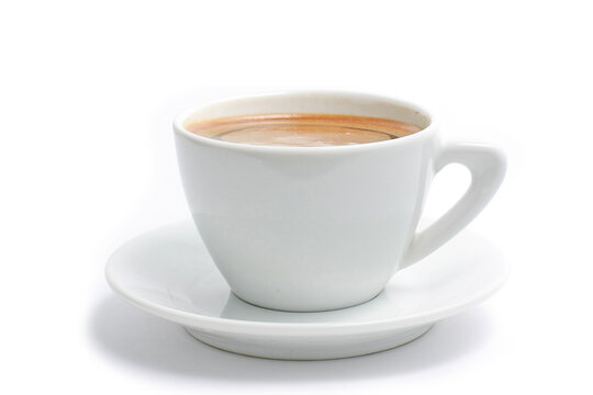 Side view close up of a white ceramic coffee cup with saucer isolated on a clean white background
