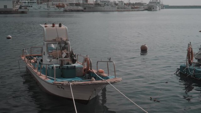Small Wooden Fishing Boat Moored at Peaceful Harbor in Gijang, Busan, South Korea