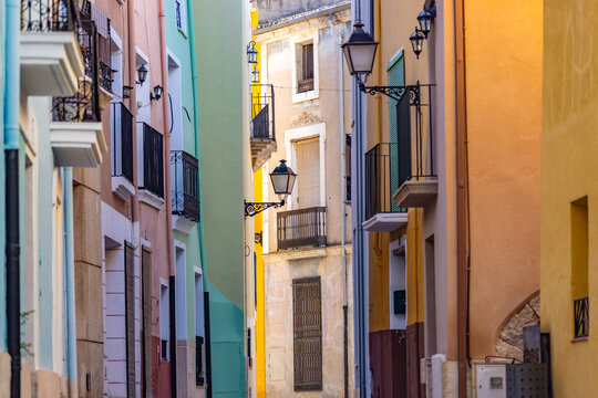A picturesque street with colourful fa&ccedil;ades in the historic centre of Biar, Alicante, Spain