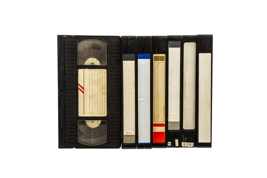 Row of vintage VHS video tapes isolated on white back