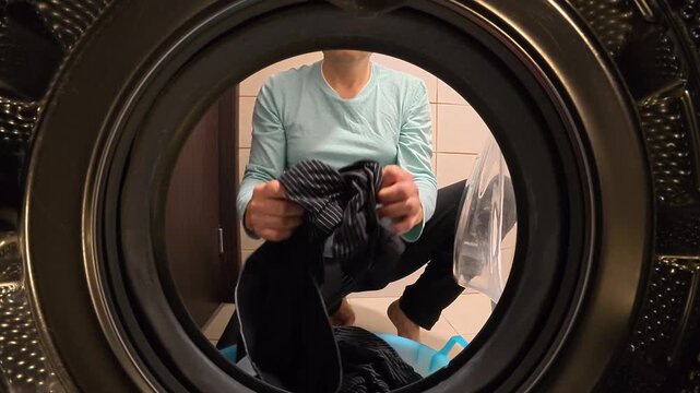 Unloading Dark Clothes and Closing Washing Machine Door