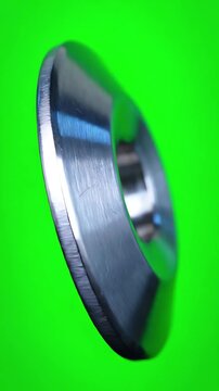 Metallic Belleville Washer Rotating Slowly on Chroma Key Green Screen for Industrial Hardware Compositing