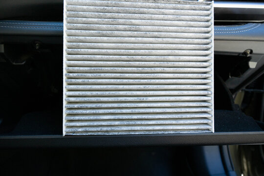 Replacing a dirty cabin air filter in an automobile