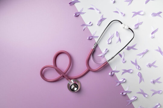Purple and white background with ribbons and stethoscope.  Testicular Cancer Awareness Month background with copy space, April