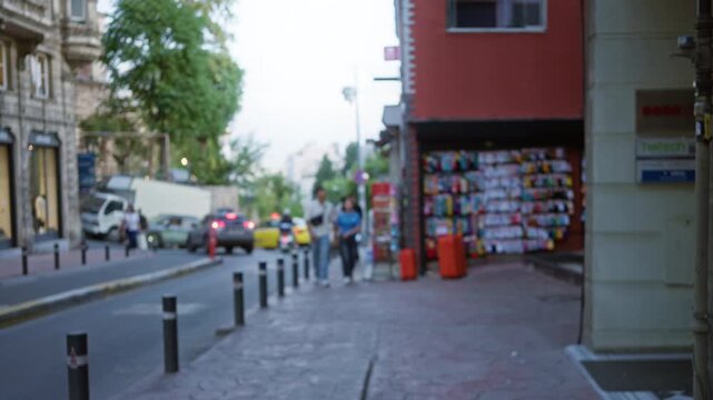 Istanbul urban scene with defocused bokeh sidewalk and storefront, blurred road texture street; background backplate copyspace calm.