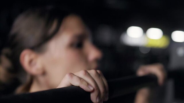Close up of hands gripping a padded barbell