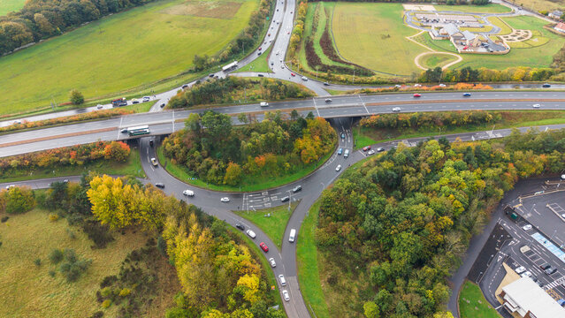 Aerial view of vehicles navigating Old Craighall roundabout and highway overpass near Edinburgh