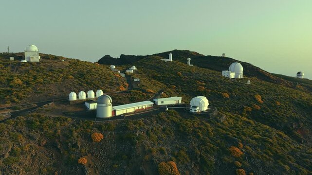 Aerial view of Roque de los Muchachos Observatory telescopes on mountain ridge, La Palma, Canary Islands